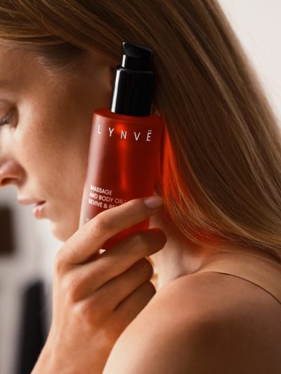 lynve body oil, red bottle