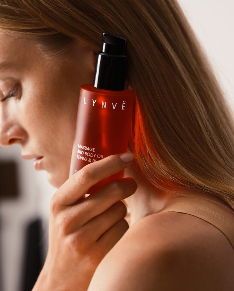 lynve body oil, red bottle